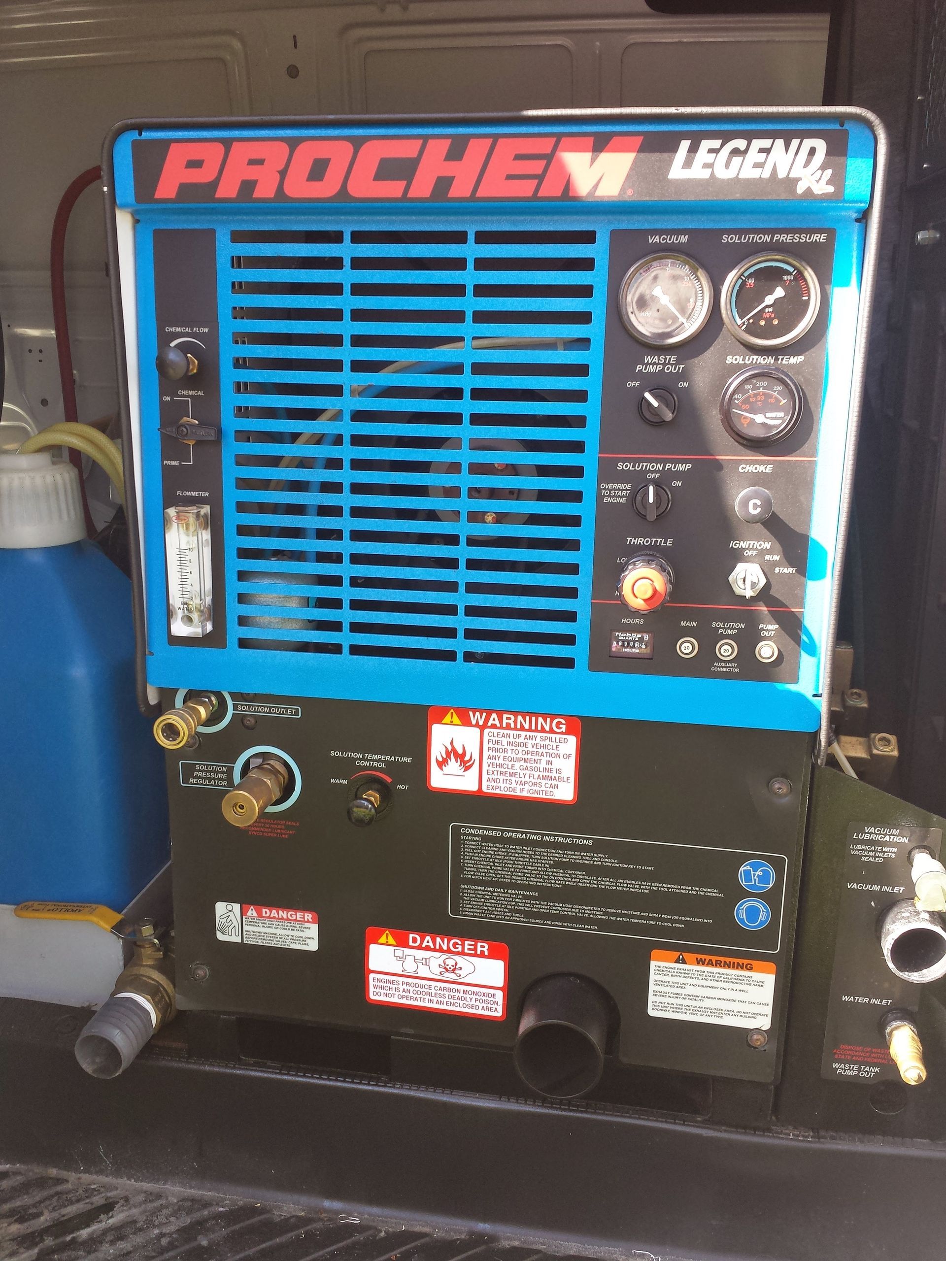 Blue Pochem Leger air compressor with gauges and control knobs in a workshop setting